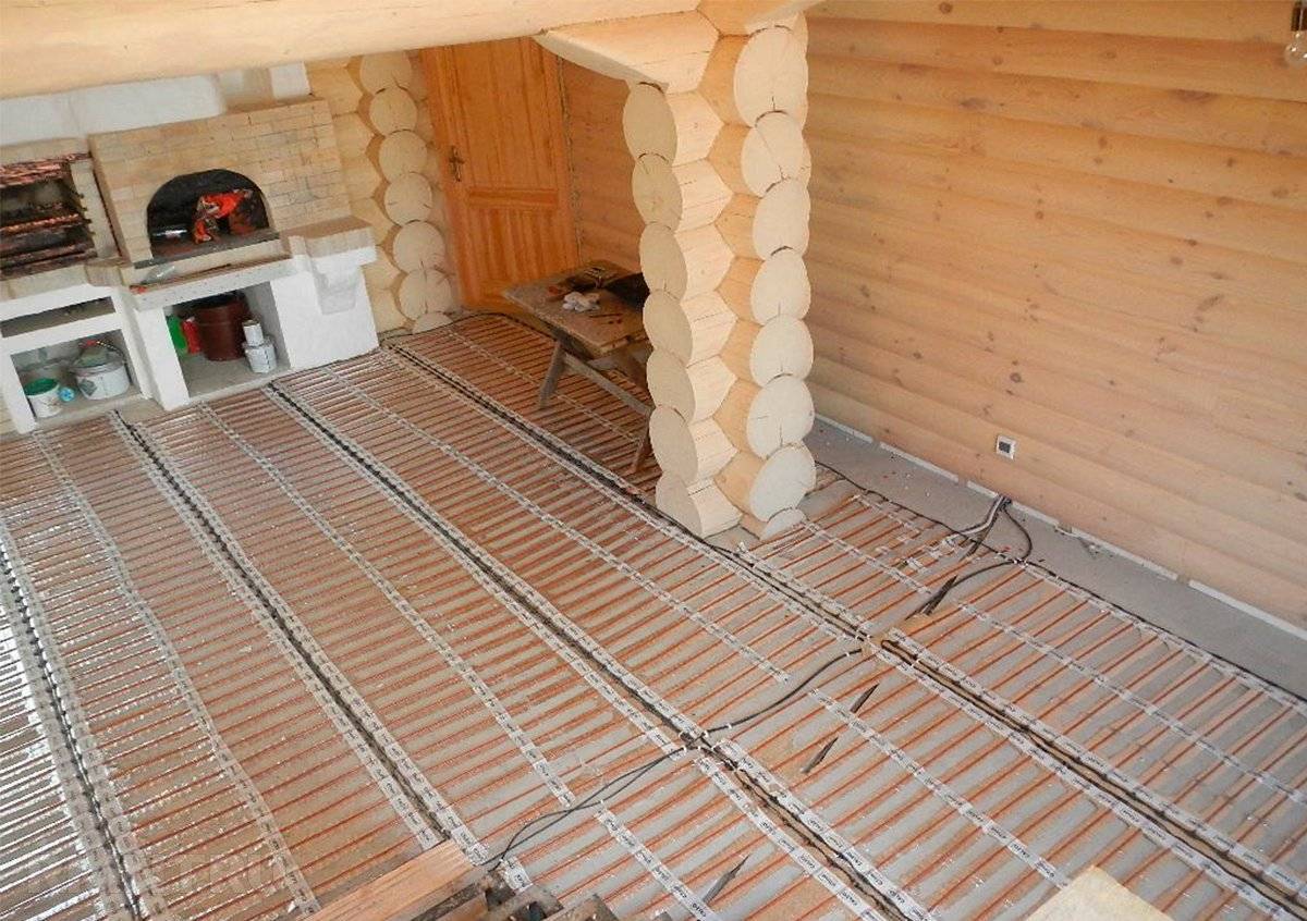 Теплый пол в деревянном доме - виды и способы устройства